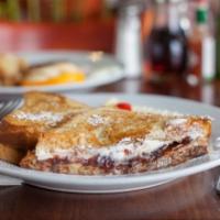 Stuffed French Toast · Cream cheese and strawberry jam inside. Includes butter and pancake syrup.
