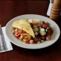 Denver Omelet · Organic eggs, ham, bell pepper, cheddar cheese and onion. Served with roasted red potatoes.