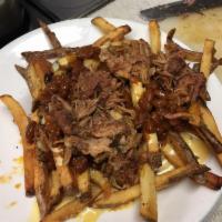Fancy Fries · Fresh-Cut Fries, BBQ beans, Green Chili Queso and Slow Smoked Pulled Pork.