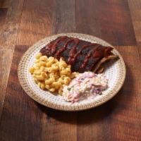 Half Rack of Ribs Dinner Plate · Half Rack of Dry Rubbed Baby Back Ribs, House Made BBQ Sauce on Side.Choice of 2 Sides.
