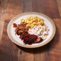 Two Meat Dinner Plate · Choose 2 of our Slow Smoked Meats, Includes 2 Sides and House Made BBQ Sauce on Side