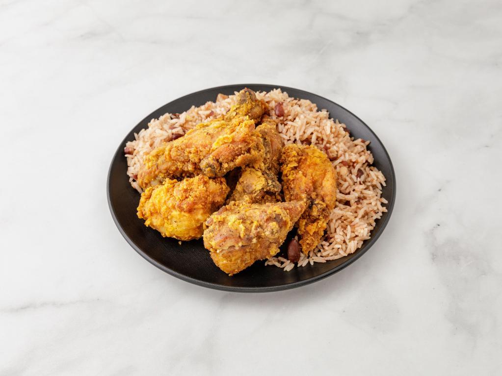 Fried Chicken · Served with roti, white rice, pea and rice, vegetable rice or boiled provision with steamed vegetables and plantains.