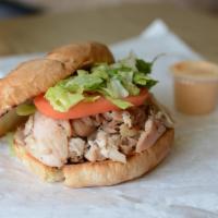 Chicken Dark · Pulled rotisserie chicken dark meat, lettuce, and tomato in a toasted kaiser roll.