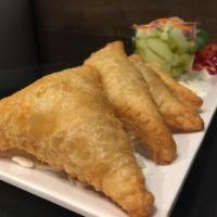 A15. Chicken Curry Puffs · Puff pastry, Stuffed with chopped chicken,potato, onions, carrots and curry powder. Served w...