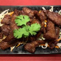 Thai Pork Jerky · Strips of Flank Steak specially marinated with Thai herbs and spices, lightly fried, then se...