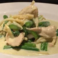 C2. Green Curry · Zucchinis, green beans and bell peppers with fresh leaves of basil for flavor. Served with j...
