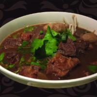 NS4. Boat Noodles Soup · Beef stew, beef tendon, beef liver and beef balls with rice noodles in a beef broth with coo...
