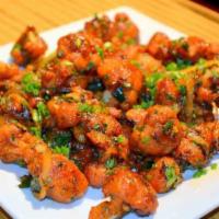 Vegetable Manchurian · Vegetarian deep fried balls tossed with soya sauce based gravy coked to chef's perfection.