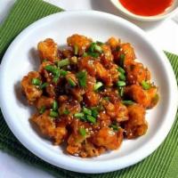 Chicken Manchurian · Deep fried spiced chicken tossed with soya sauce based gravy cooked to chef's perfection.