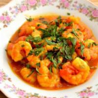 Shrimp Curry · Shrimp dish made with typical spices and house gravy.