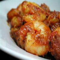 Shrimp Vindaloo · A spicy dish cooked in tangy gravy with potatoes, coconut and curry leaves in combination wi...