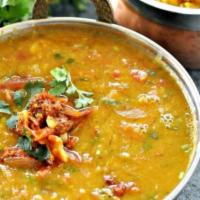 Tadka Dal · Boiled yellow lentil tempered with cumin, mustard, garlic and curry leaves.
