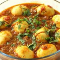 Anda Curry · Egg Masala. Boiled egg cooked with homemade tangy gravy.