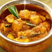 Chicken Chettinadu · Chicken dish made with roasted ground exotic spices peppercorn, star anise and coconut.