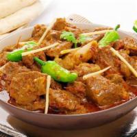 Kadai Goat · Goat cooked with bell peppers, onions and tomatoes with a touch of cream and onion gravy.