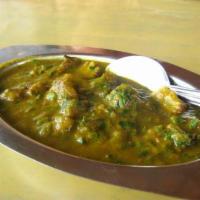 Goat Saagwala · Goat cooked with combination of simmered spinach and house spices.