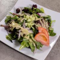 Chago Salad · Spring mix salad with tomatoes, red onions, cucumbers with house dressing cilantro vinaigret...