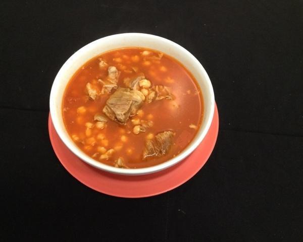 Pozole Soup · Pork soup with lettuce, radish and onions on the side.