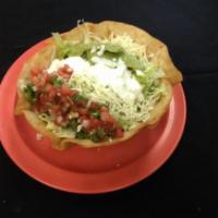 Taco Salad · Cheese, rice, beans, salsa, sour cream, guacamole, lettuce and choice of meat.