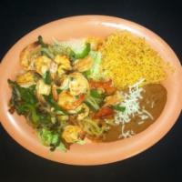 Camarones Rancheros · Shrimp with bell peppers, onions, tomatoes and mild sauce with rice, beans, lettuce and tort...