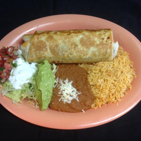 Señor Burrito · It comes with your choice meat and cheese on the inside. On the outside, it comes with Rice, Beans, Salsa, Sour cream, Guacamole, and Lettuce.