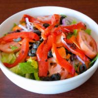 House Salad · Fresh herb of romaine, tomatoes, cucumbers, carrots, onions and olives.