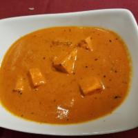 Paneer Tikka Masala · Paneer cooked in a special creamy tomato sauce with aromatic spices and herbs.