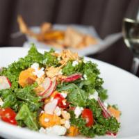 Kale and Roasted Sweet Potato · Spinach, tomatoes, spiced almonds, radish, goat cheese and garlic thyme vinaigrette. Vegetar...