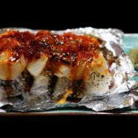 Scallop Forever · Unagi, mango, macadamia nuts roll, topped with scallop, spicy garlic sauce, wasabi sauce, ho...