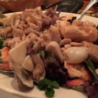 Seafood Salad · Mixed green salad with seafood and a vinaigrette dressing.