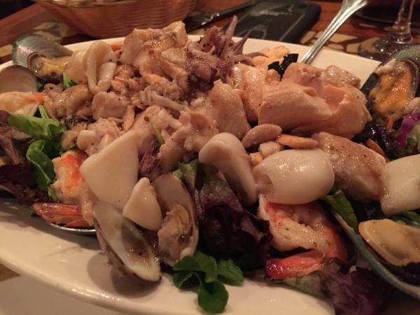Seafood Salad · Mixed green salad with seafood and a vinaigrette dressing.