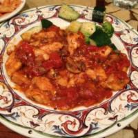 Pollo Alla Cacciatore · Chicken, onions, mushrooms, and bell peppers in tomato sauce.