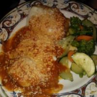 Vitello Parmigiana · Breaded veal fillets topped with cheese and tomato sauce.