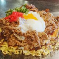 Gyusuki Okonomiyaki · Stewed beef and fried egg on top of okonomiyaki topped with pickled ginger. U.S. Only!