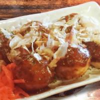 Takoyaki · 6 pieces of flour balls with diced octopus inside served with bonito flakes, mayo and sauce