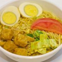Laksa Veggie · Delicious bowl of rice noodles with tofu, fish cake, boiled eggs and bean sprouts added; ser...
