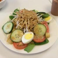 Gado Gado · An Indonesian salad of fresh cucumbers, spinach, tomatoes, bean sprouts, boiled eggs and tof...