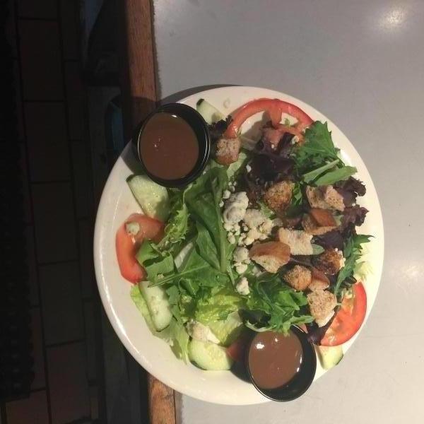 Sig's Salad · Mixed greens, cucumbers, tomatoes, croutons, crumbled blue cheese and signorelli's Italian dressing.