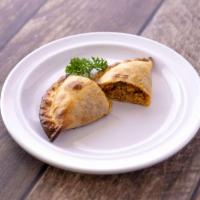 Spicy Chicken Empanada · Chicken, onions, bell peppers, peas, carrots and Thai chili. Spicy.