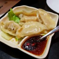 104. Gyoza · Pork and vegetable dumplings, served with soy ginger sauce. Comes steamed or fried on your c...