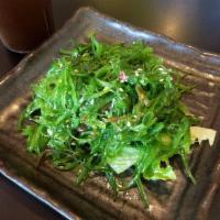 109. Seaweed Salad · Fresh seaweed seasoned and topped with sesame seeds.