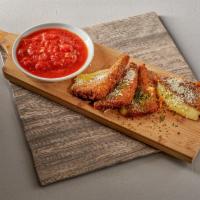 Fried Mozzarella · Mozzarella cheese lightly breaded and fried to a golden brown. Served with marinara sauce.
