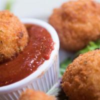 Fried Risotto Balls · Italian rice balls stuffed with ground beef and mozzarella cheese, coated with panko crumbs ...