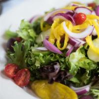 Garden Salad · Romaine lettuce, tomatoes, cucumbers, hot and green peppers, onions and black olives. Balsam...