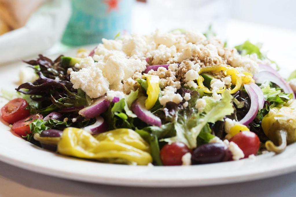 Greek Salad · Feta cheese, Kalamata olives and pepperoncinis over romaine with a balsamic vinaigrette.