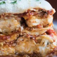 Homemade Lasagna Dinner · Pasta ribbons layered with marinara, ground meat, ricotta and mozzarella cheeses.
