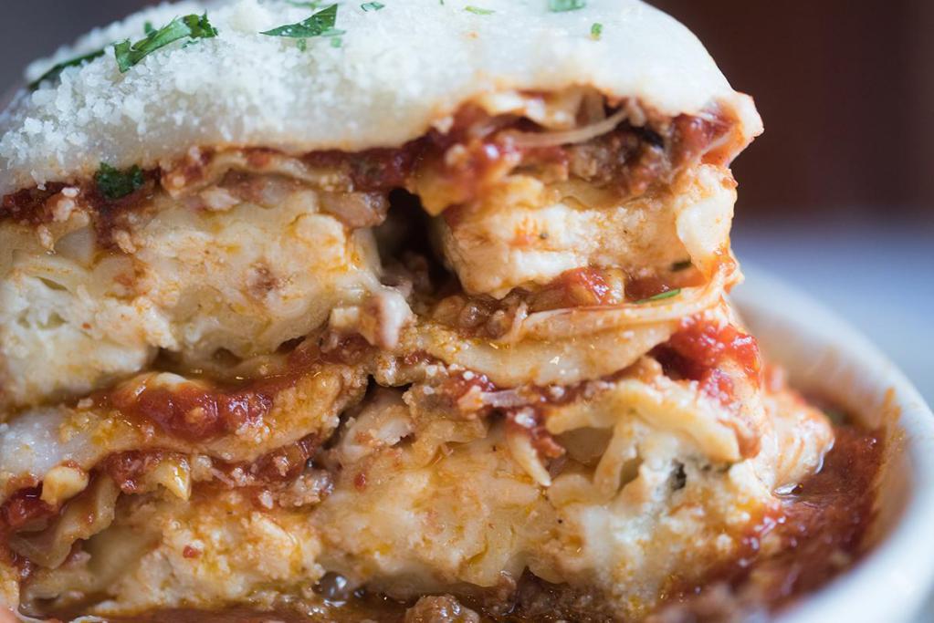 Homemade Lasagna Dinner · Pasta ribbons layered with marinara, ground meat, ricotta and mozzarella cheeses.