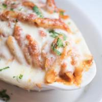 Baked Ziti Dinner · Penne pasta with ricotta cheese and tomato sauce topped with melted mozzarella cheese.
