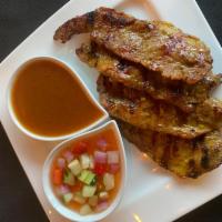 Beef Satay · Grilled beef on skewers served with cucumber salad and peanut sauce. 