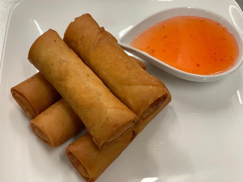 Crispy Rolls · Crispy spring rolls stuffed with chicken and vegetables and served with sweet sauce. 
